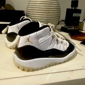 Jordan 11s Kids Black and White Sneakers